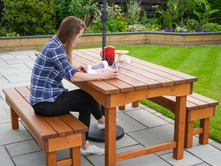 Sitting at Picnic Table and Benches with Sun Umbrella