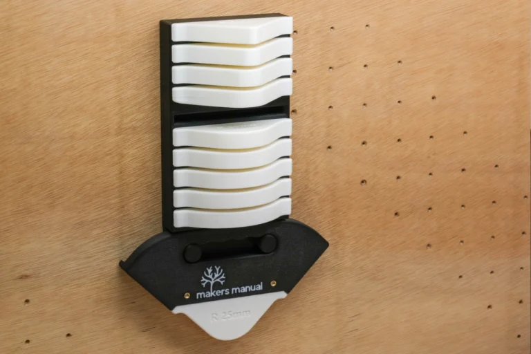 Router Radius Jig Template stored in wall mounted tool holder.